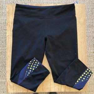 Under Armour capris black with navy and yellow accents